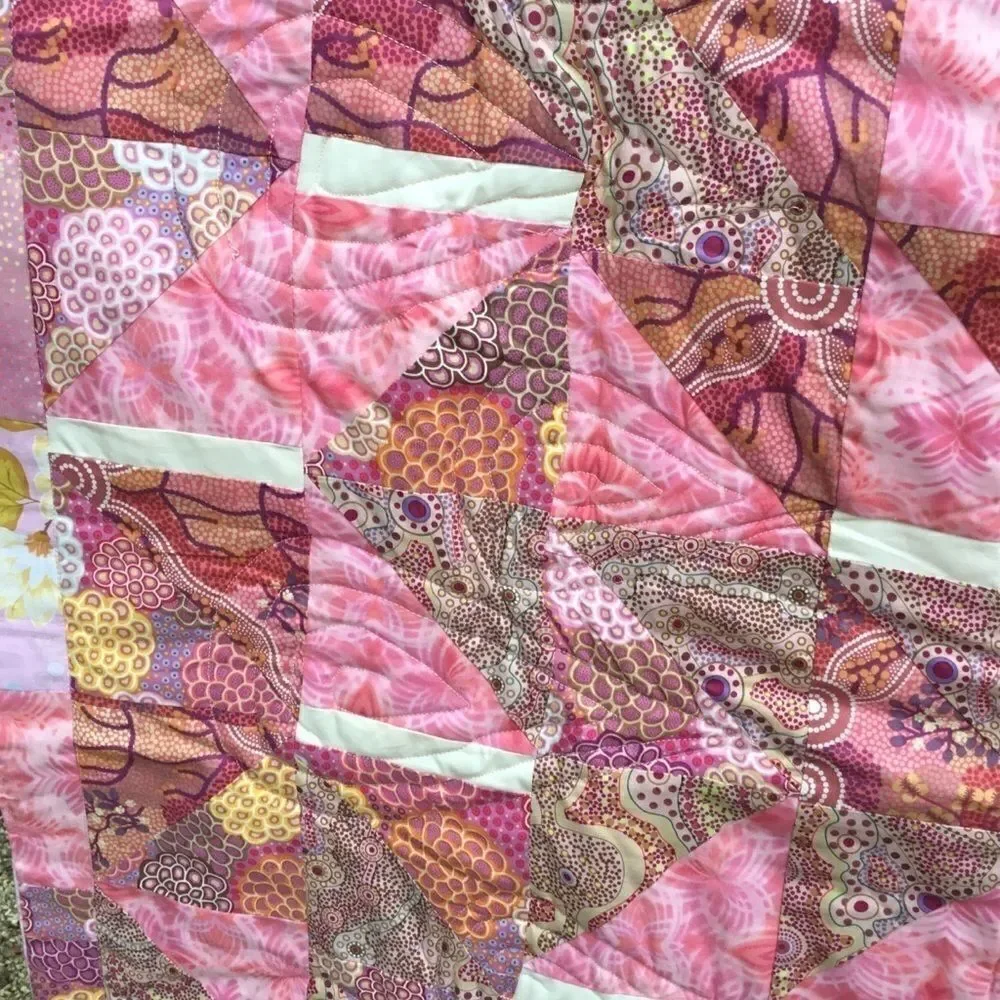 NWT. Hand Crafted Pinks Aboriginal Prints Quilt